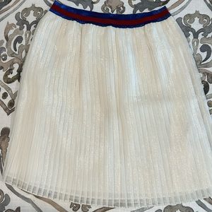 Gucci pleated skirt with red and blue waist band.